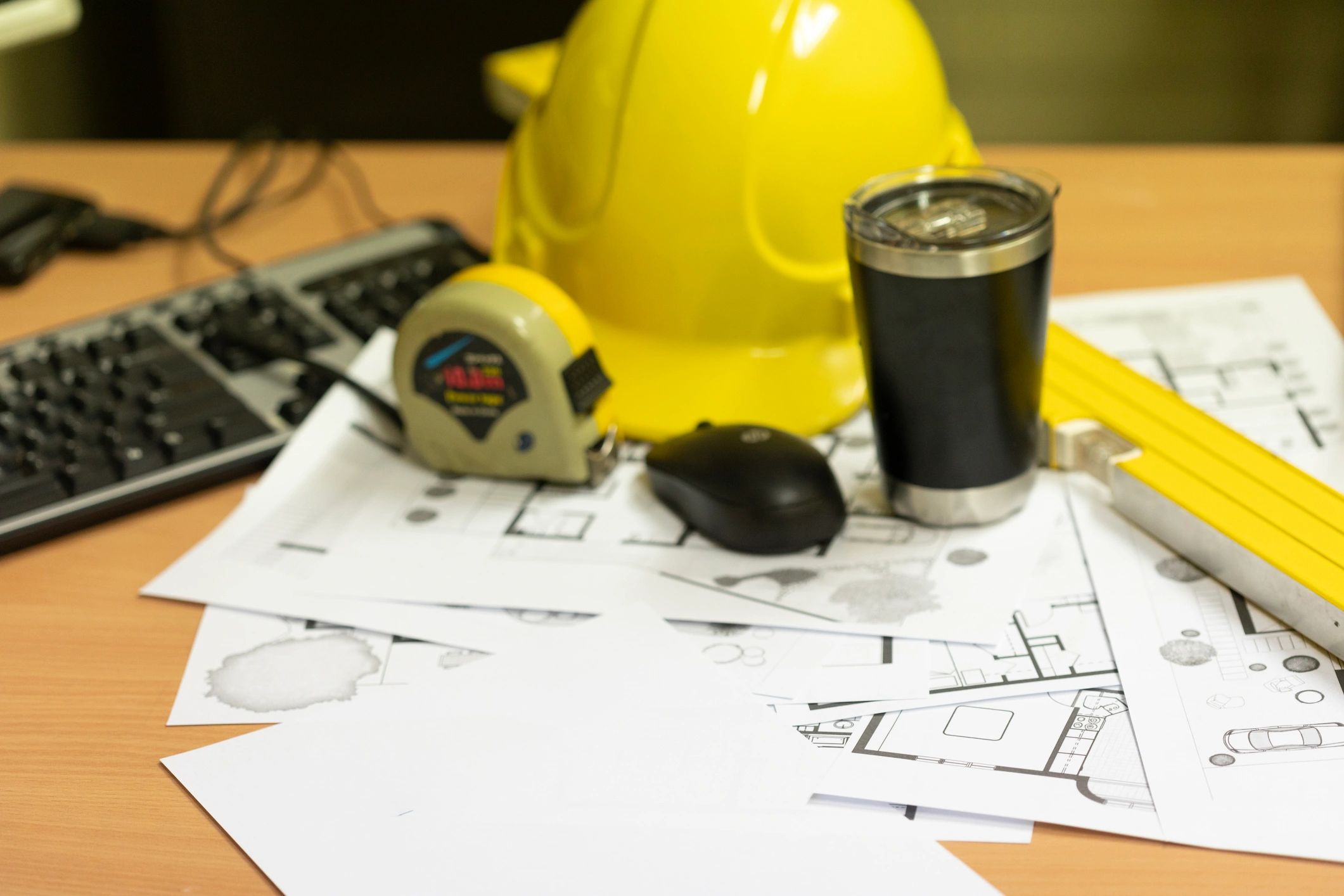 Subdivision plans and development documents on a desk