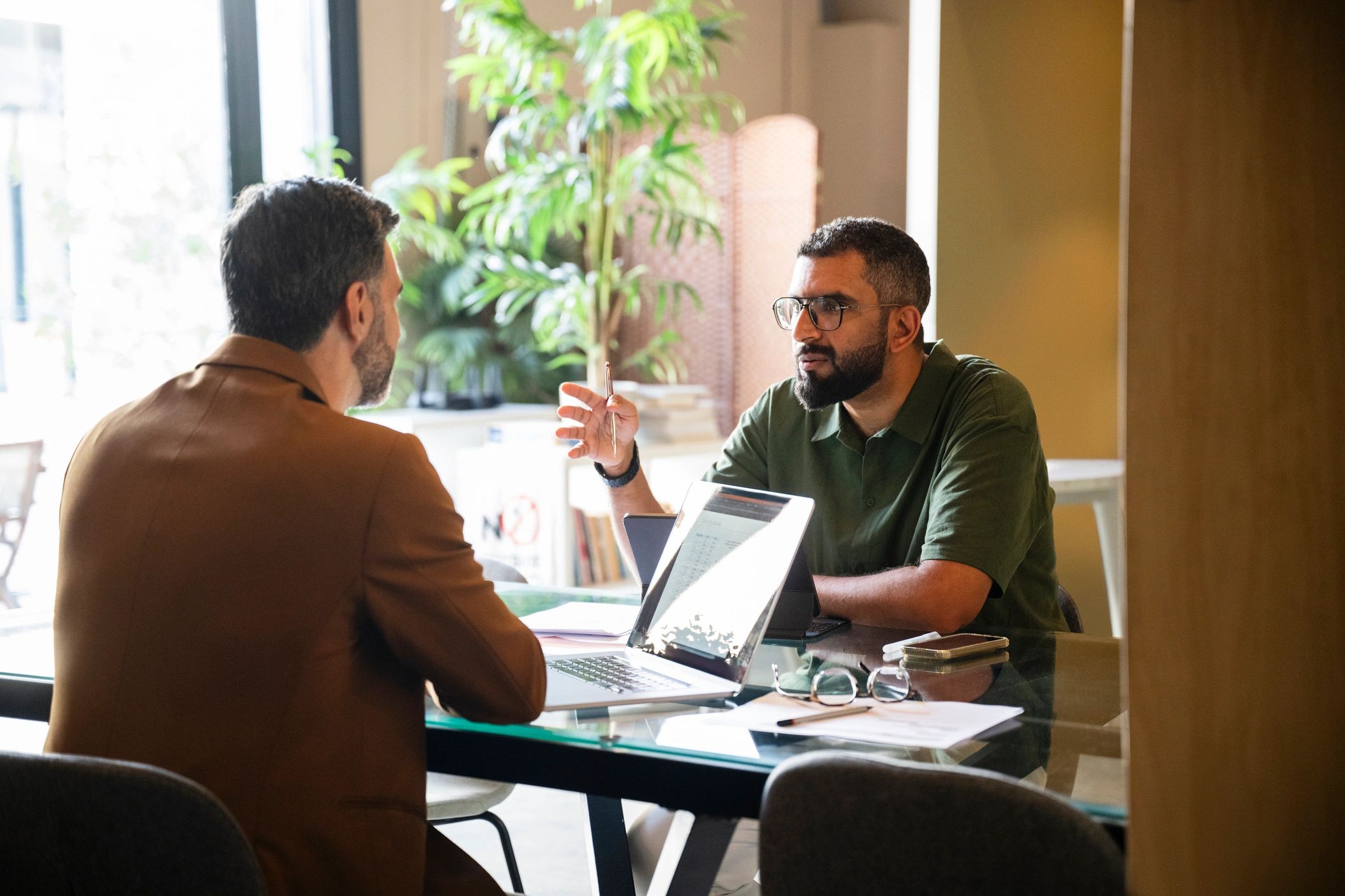 Attorney speaking with a client in a professional office
